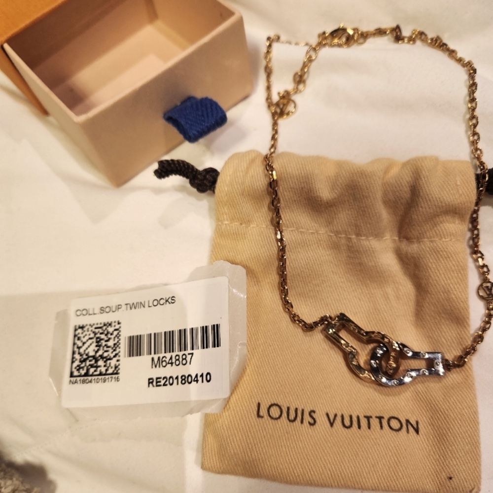 Louis Vuitton necklace.